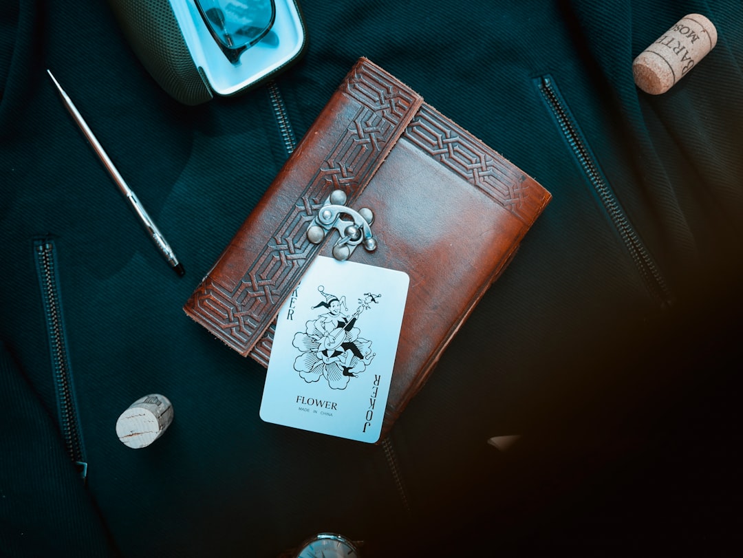 joker playing card on brown purse
