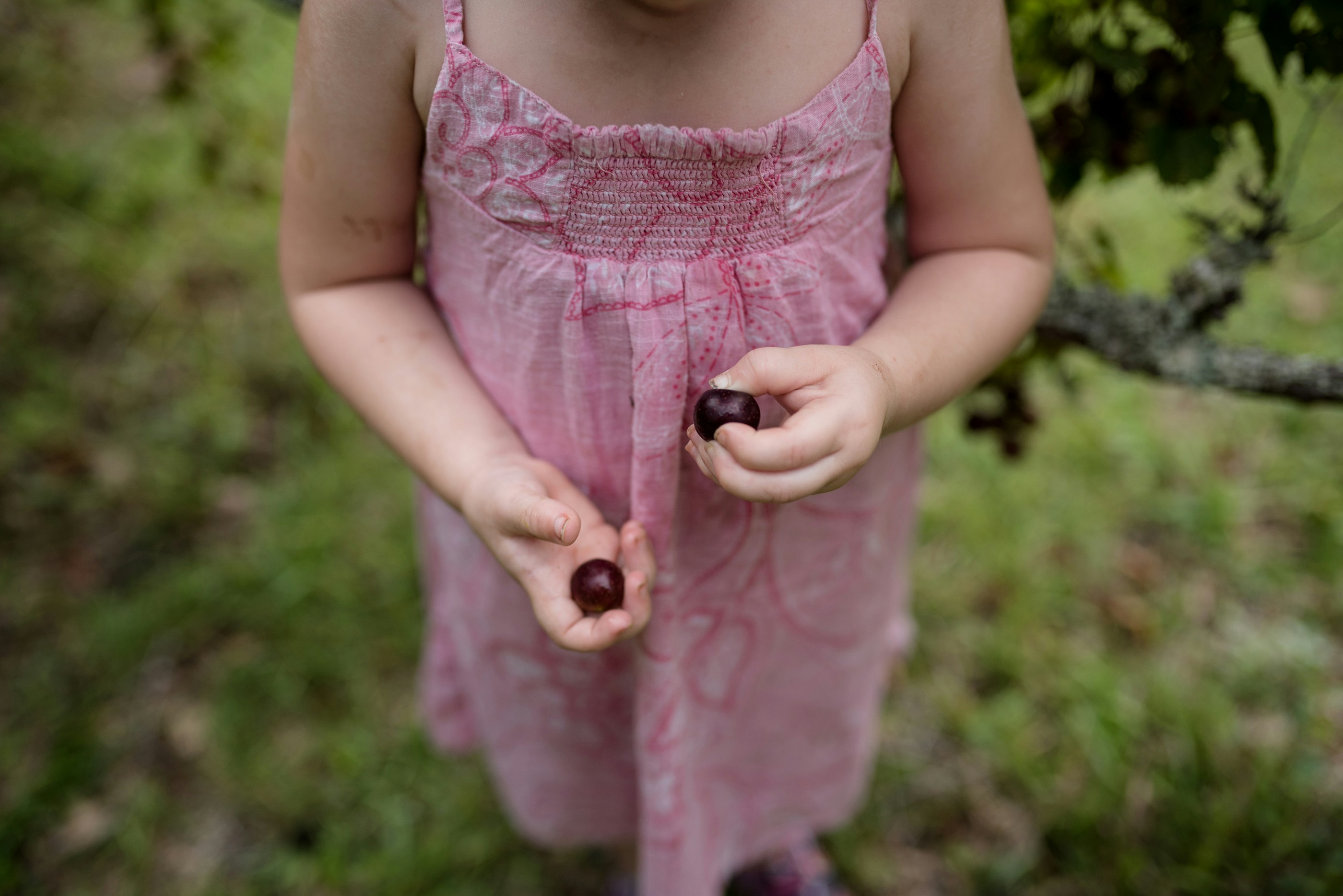 girl wearing pink spaghetti strap dress