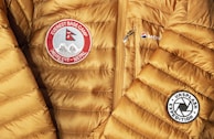 yellow and red zip-up bubble jacket