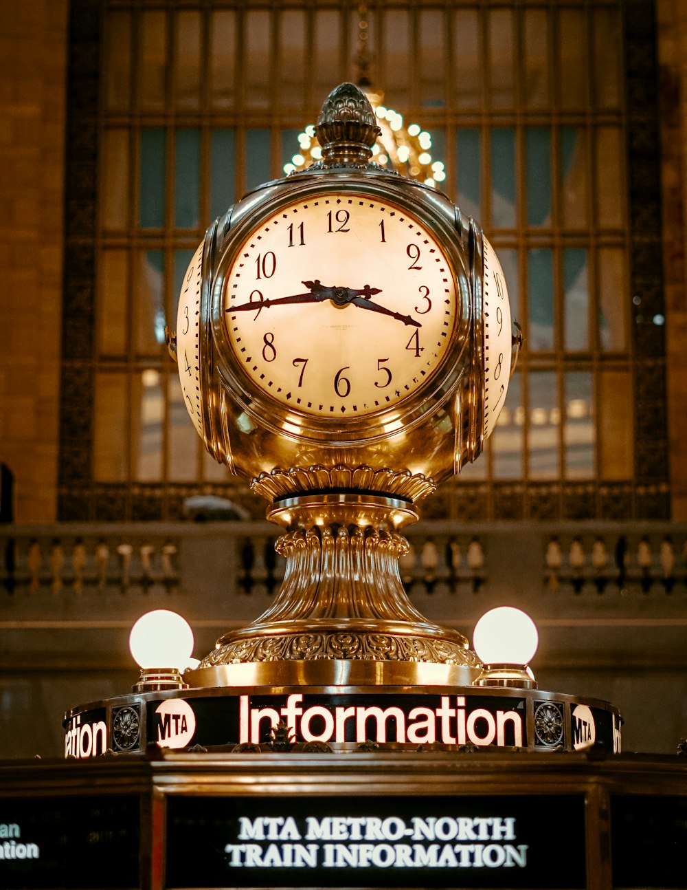 gold framed clock at 3:45 display