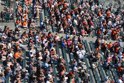 aerial photography of people sitting on benches during daytime giants teams background