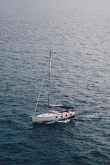 white sailboat on ocean