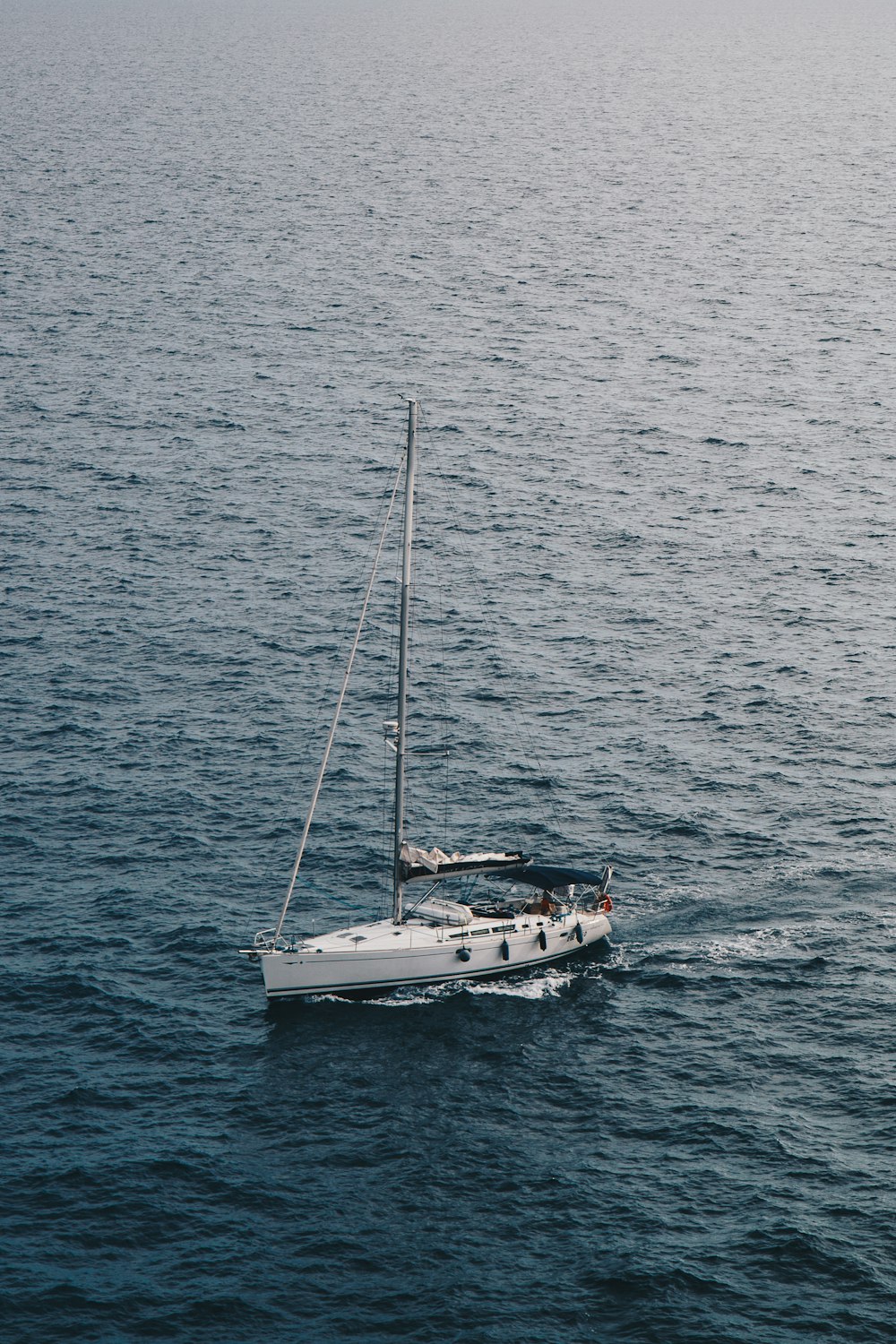 white sailboat on ocean