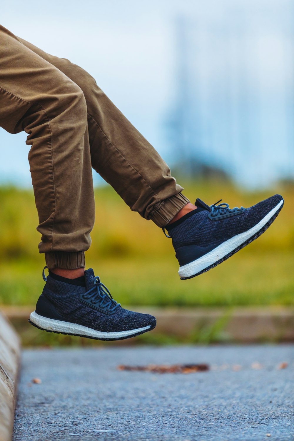 Person wearing brown jogger pants and blue adidas running shoes during  daytime photo – Free Person Image on Unsplash