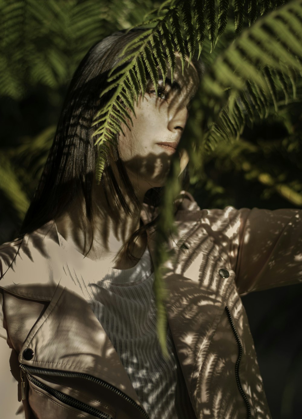 woman standing near plant at daytime