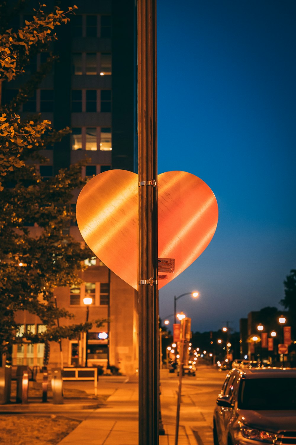 heart-shaped signage on lamp post
