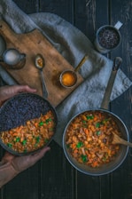 person holding pot with cook food