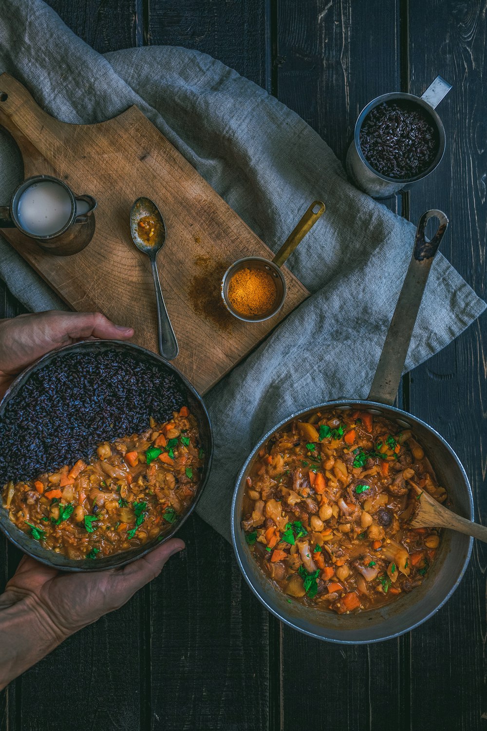 person holding pot with cook food