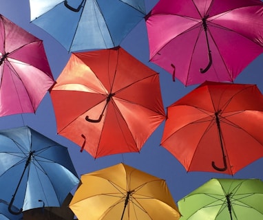 assorted-colored umbrella decor at daytime