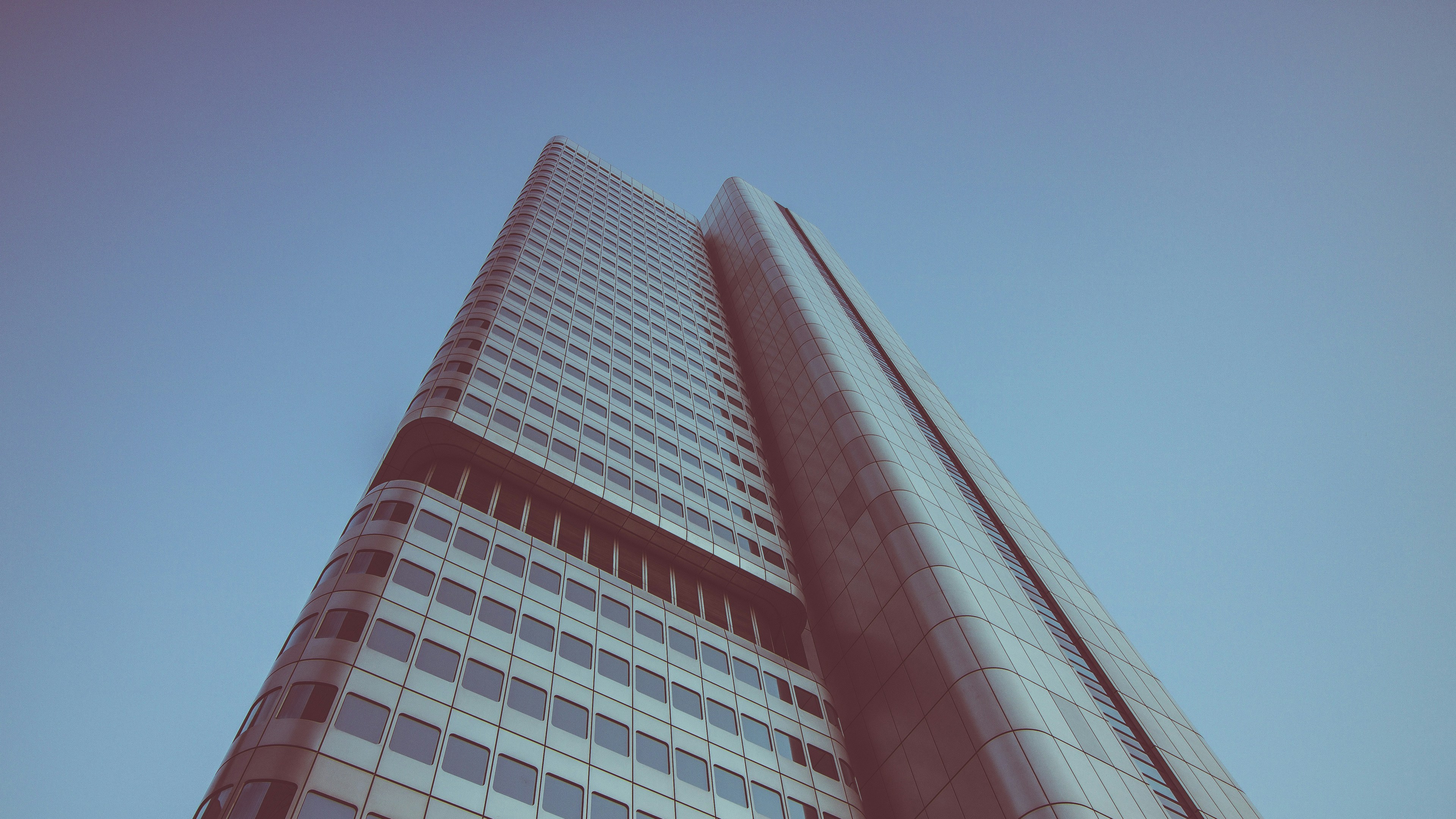 low angle photography of building under blue skies