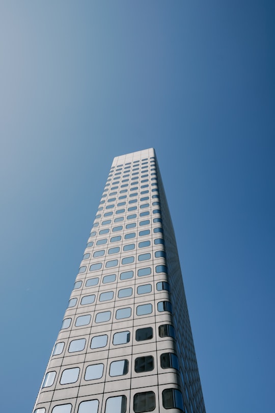 low-angle photography of grey and black high-rise building in Peak Tram Hong Kong