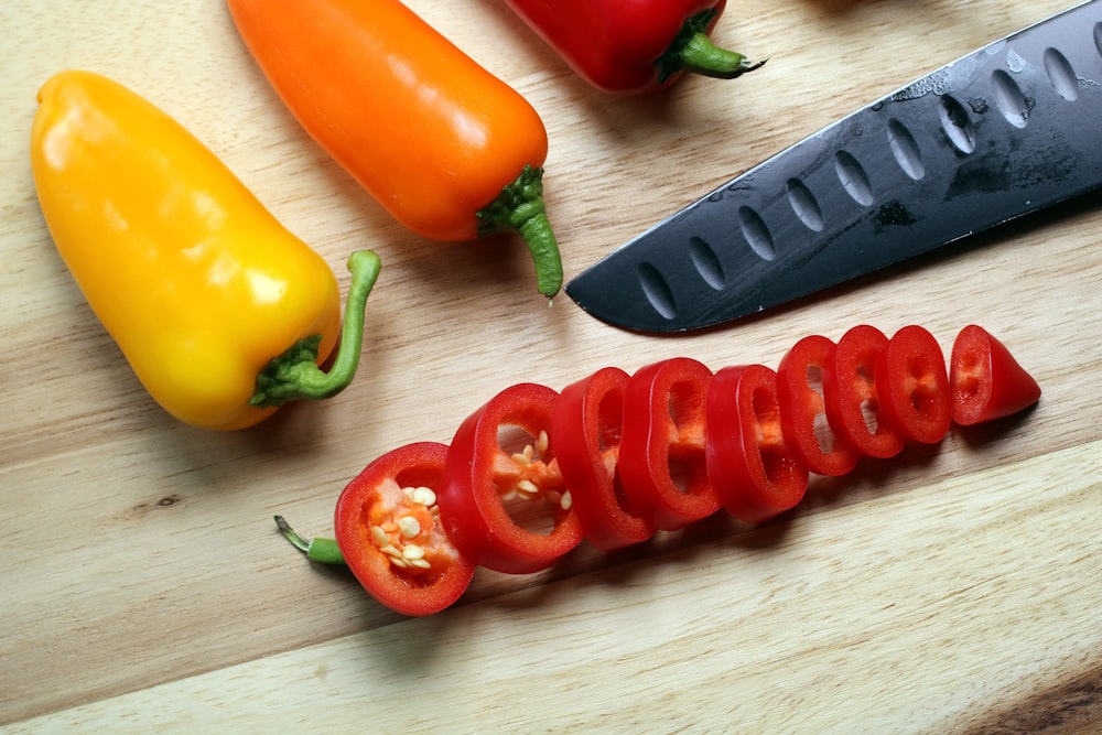 sliced red bell peppers on chopping board
