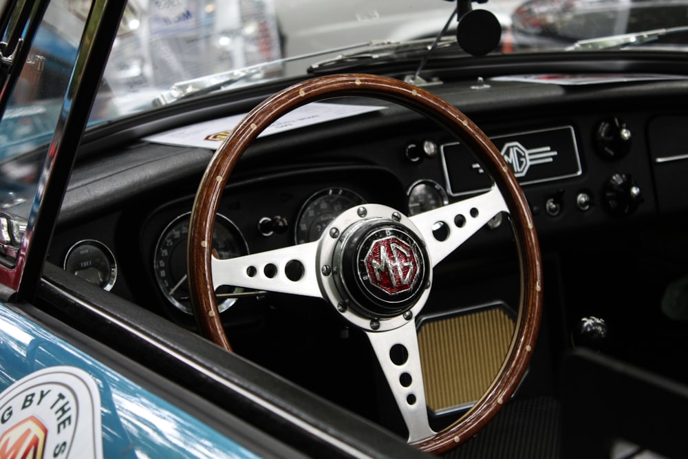 photo of brown and gray vehicle steering wheel during daytime