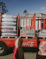 A fleet of heavy-duty trucks loaded with coke ready for dispatch across India.