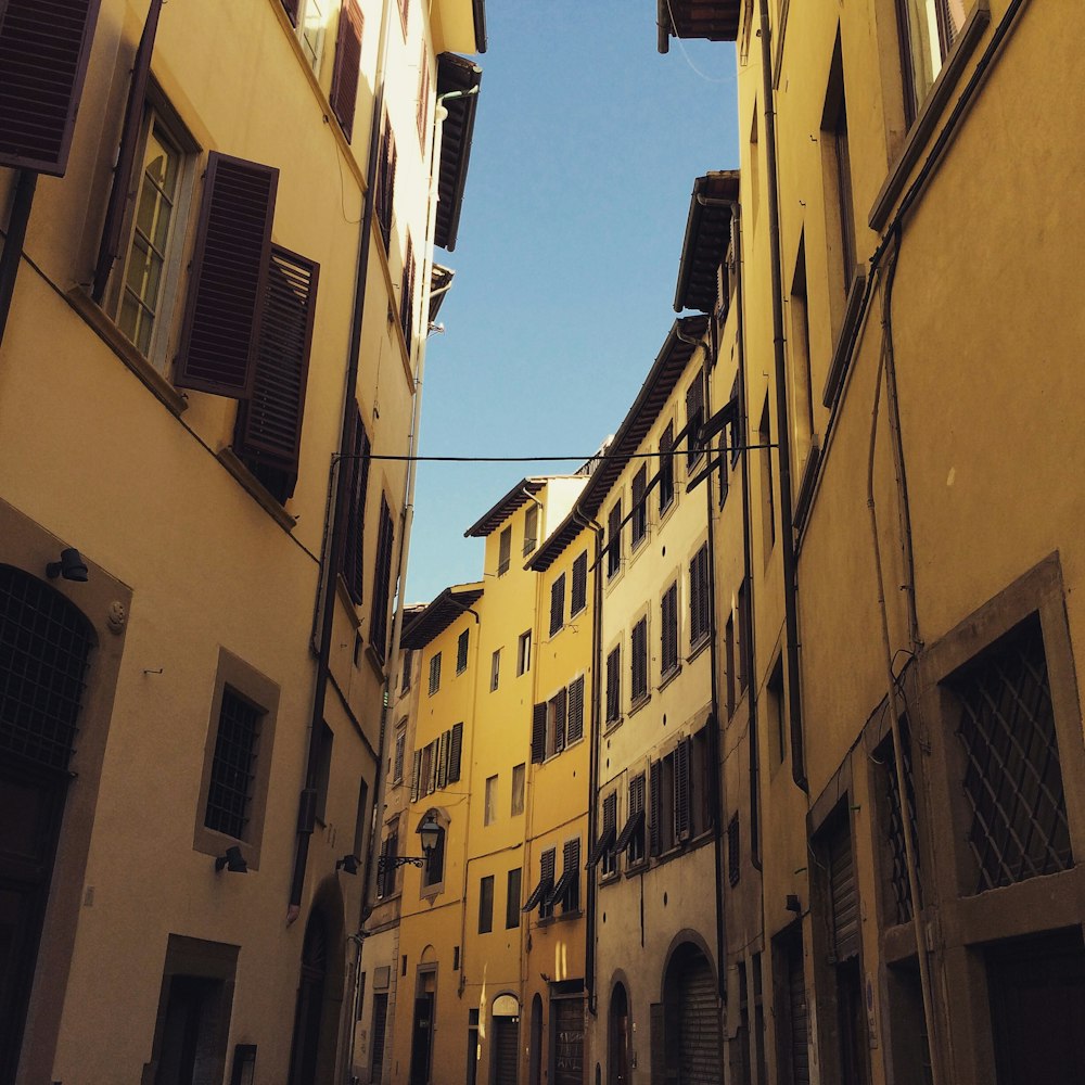 brown concrete buildings under blue sky