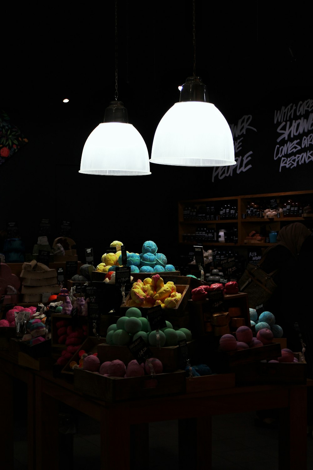 variety of pastries with turned on pendant lamps