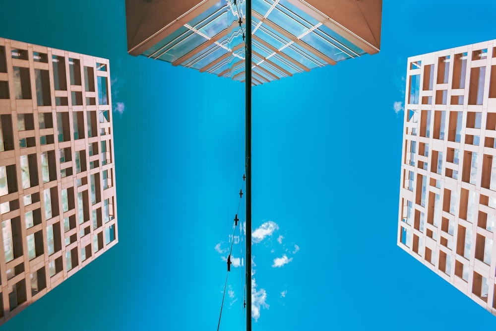 low-angle photography of brown concrete building during daytime