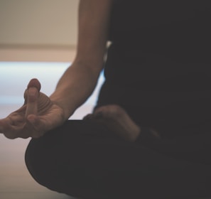 person doing yoga on floor