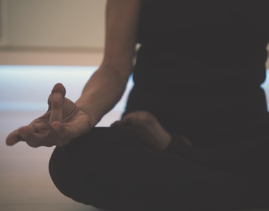 person doing yoga on floor