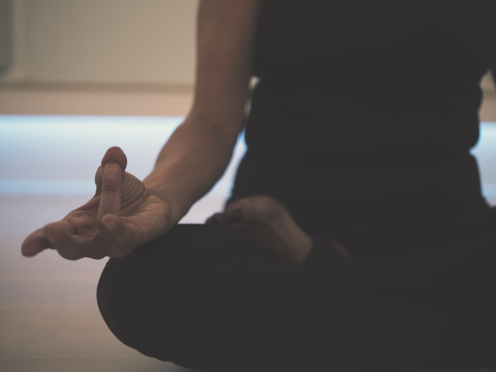 person doing yoga on floor