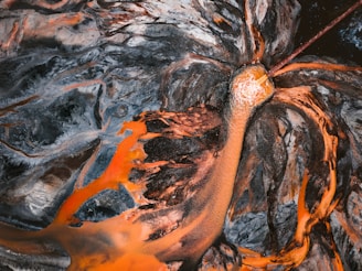 Aerial view of a vibrant abstract landscape with dark blue tones.