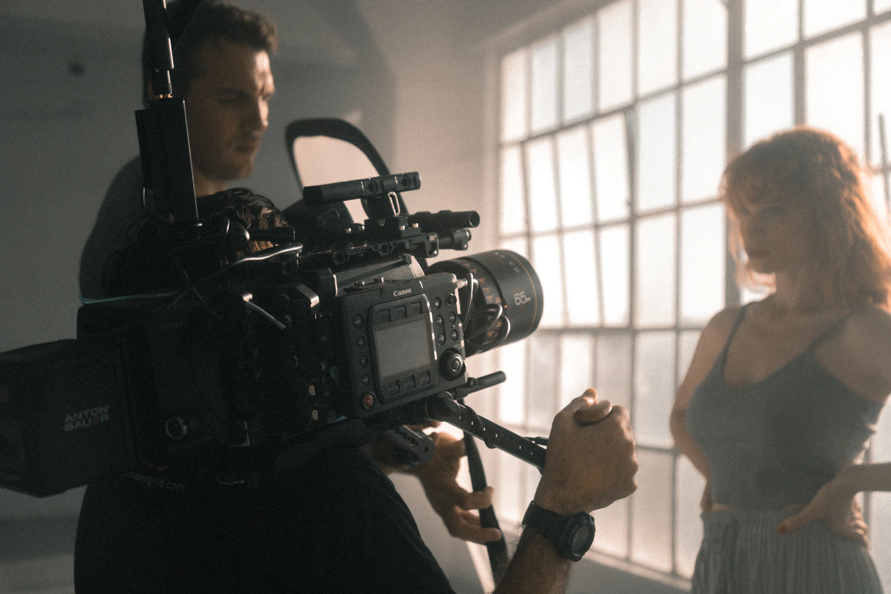 Placeholder: cinematographer filming a commercial shoot on a cinema rig — replace with real Conceive Pictures BTS footage