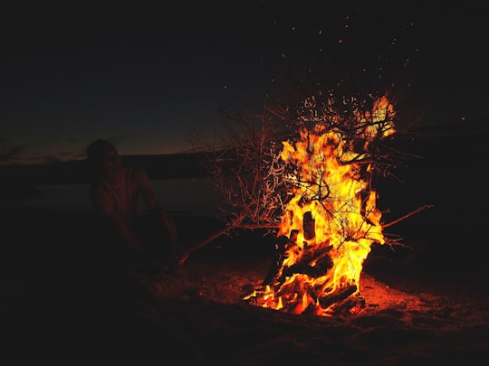 man in front of lighted bonfire in Courtown Ireland