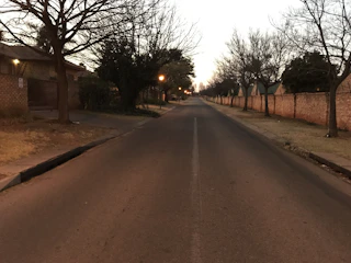A quiet urban street at dawn symbolizing the loneliness of homelessness.