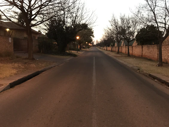 A quiet urban street at dawn symbolizing the loneliness of homelessness.