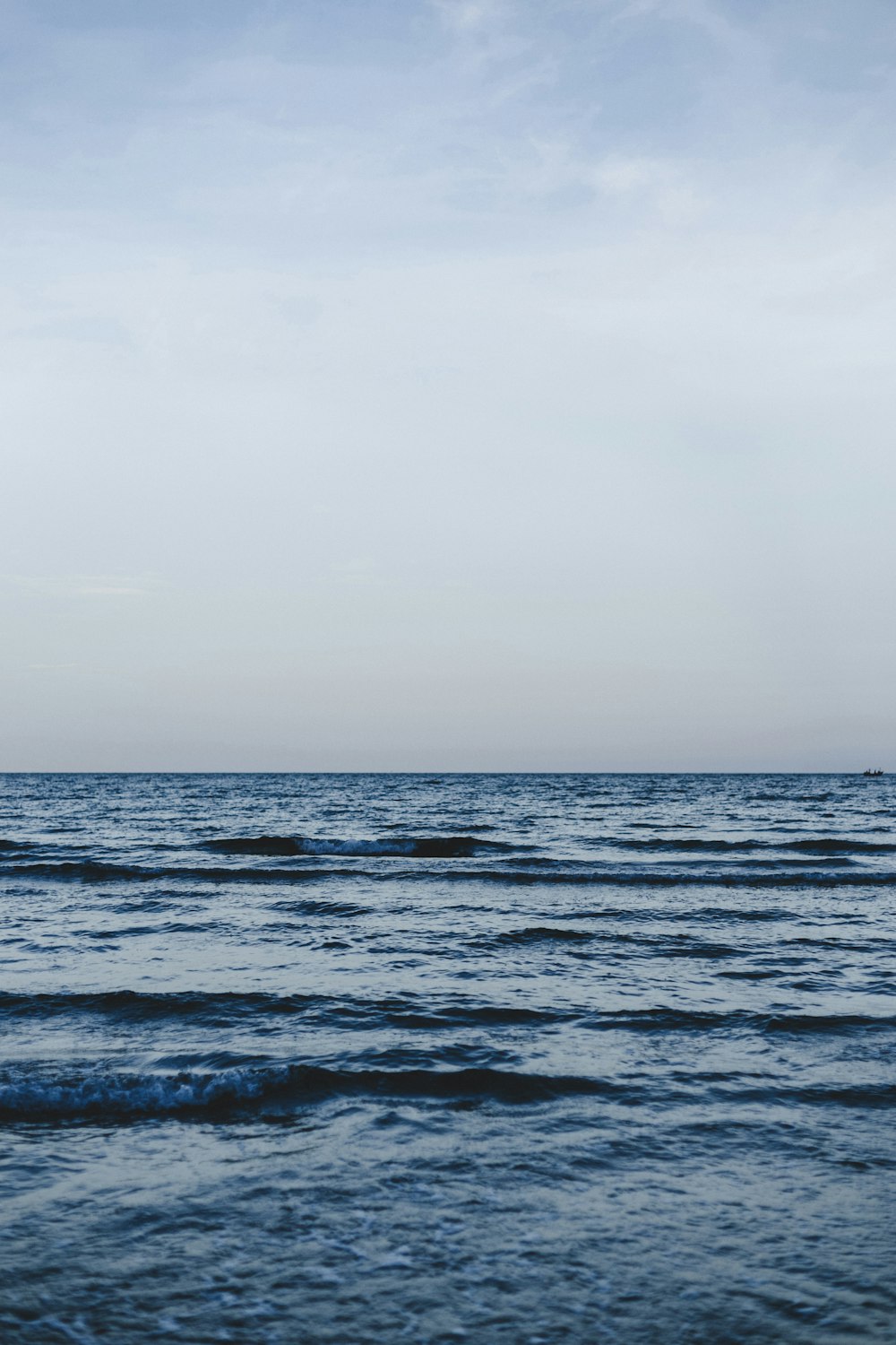 calm sea under clear blue sky during daytime