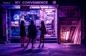 Evening view of the convenience and barbershop space with inviting warm lights