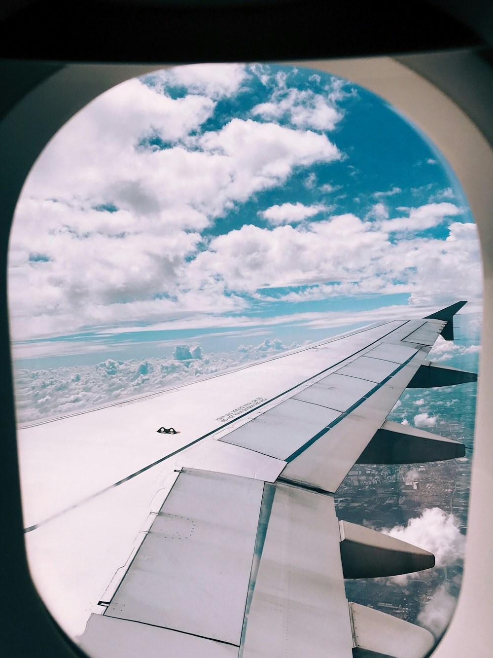 airplane above clouds during daytime