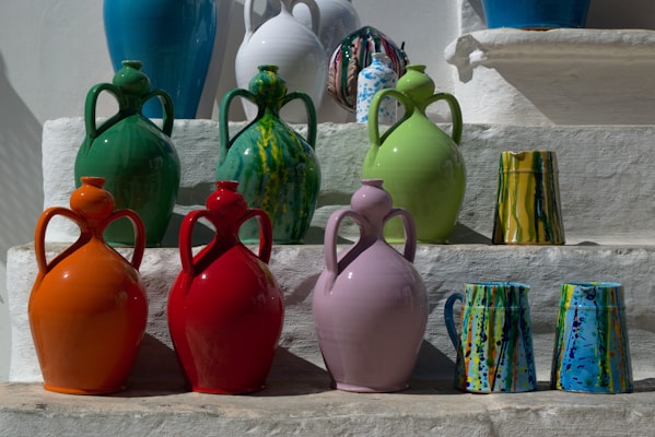 Colorful array of traditional quentão drinks steaming in clay mugs at a festive junina party