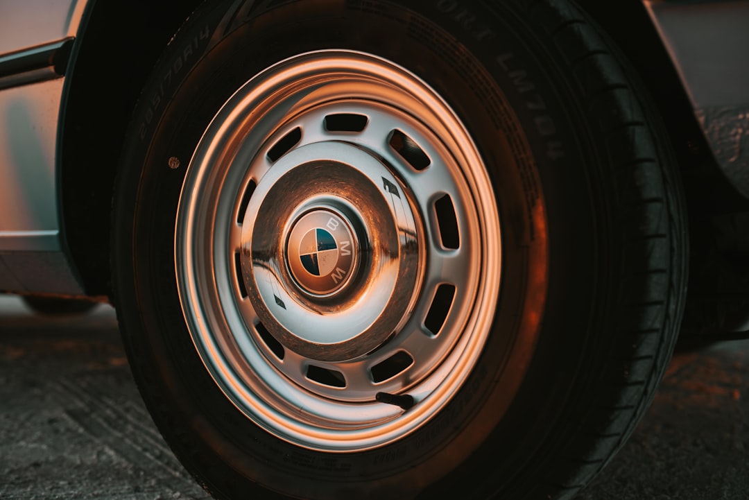 closeup photo of chrome BMW vehicle wheel and tire