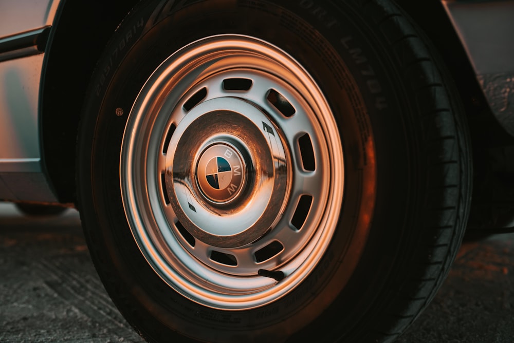 closeup photo of chrome BMW vehicle wheel and tire