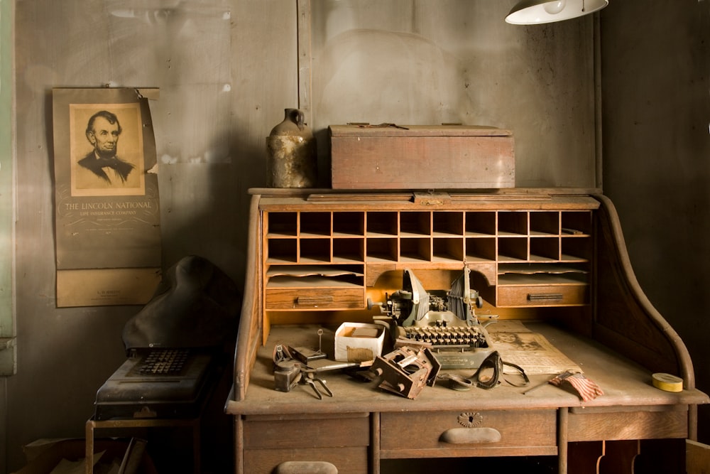 brown wooden desk with typewriter