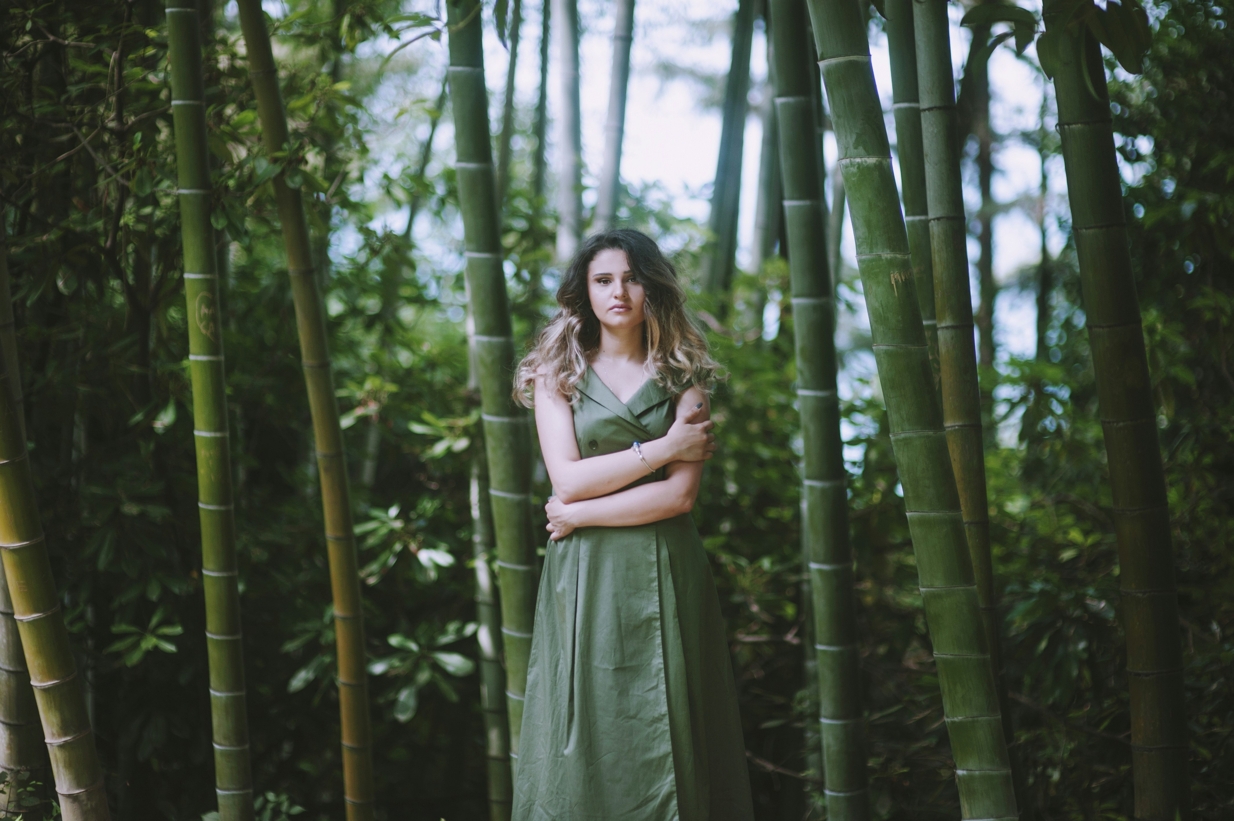 woman in green dress near bamboo trees, green green feel