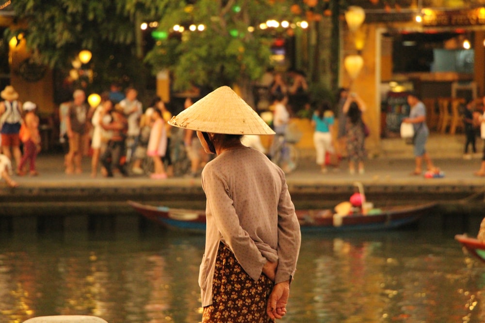 person standing and wearing conical hat