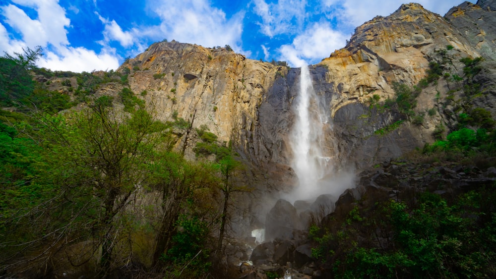 low angle photography of waterfalls at daytime