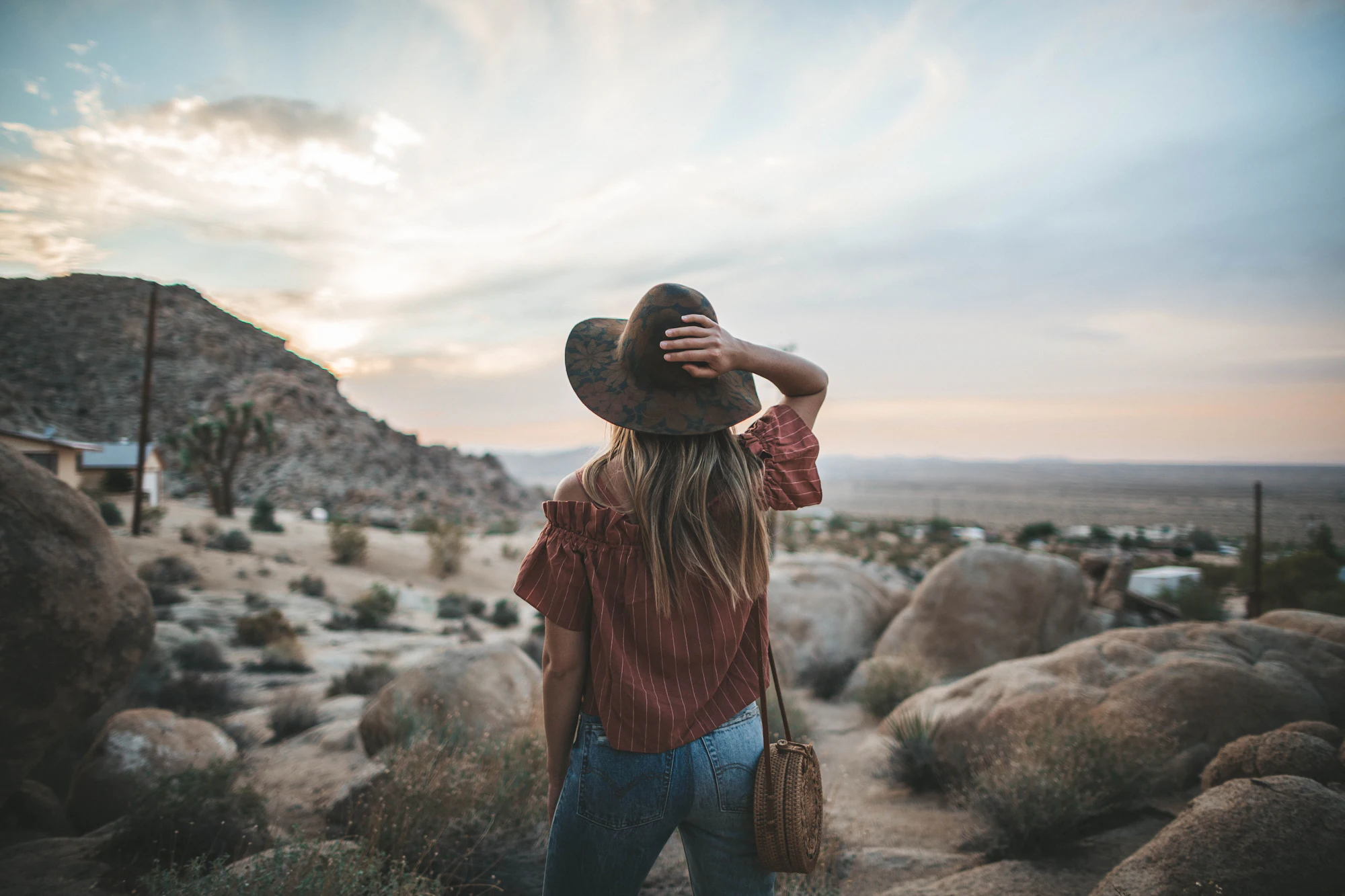 Woman standing in front of large stones