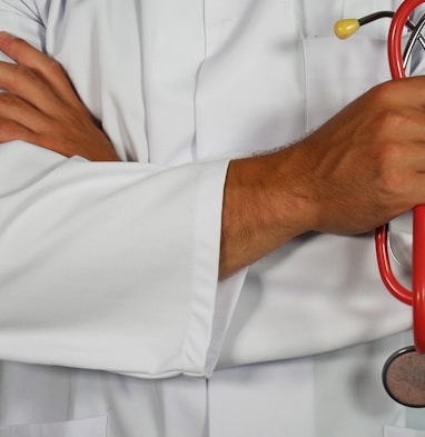 doctor holding red stethoscope