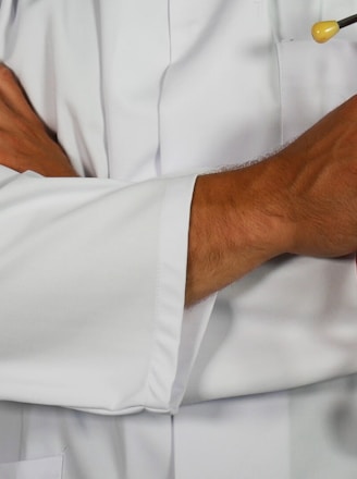 doctor holding red stethoscope