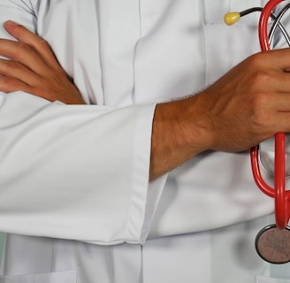 doctor holding red stethoscope