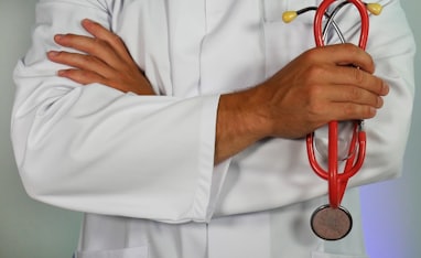 doctor holding red stethoscope