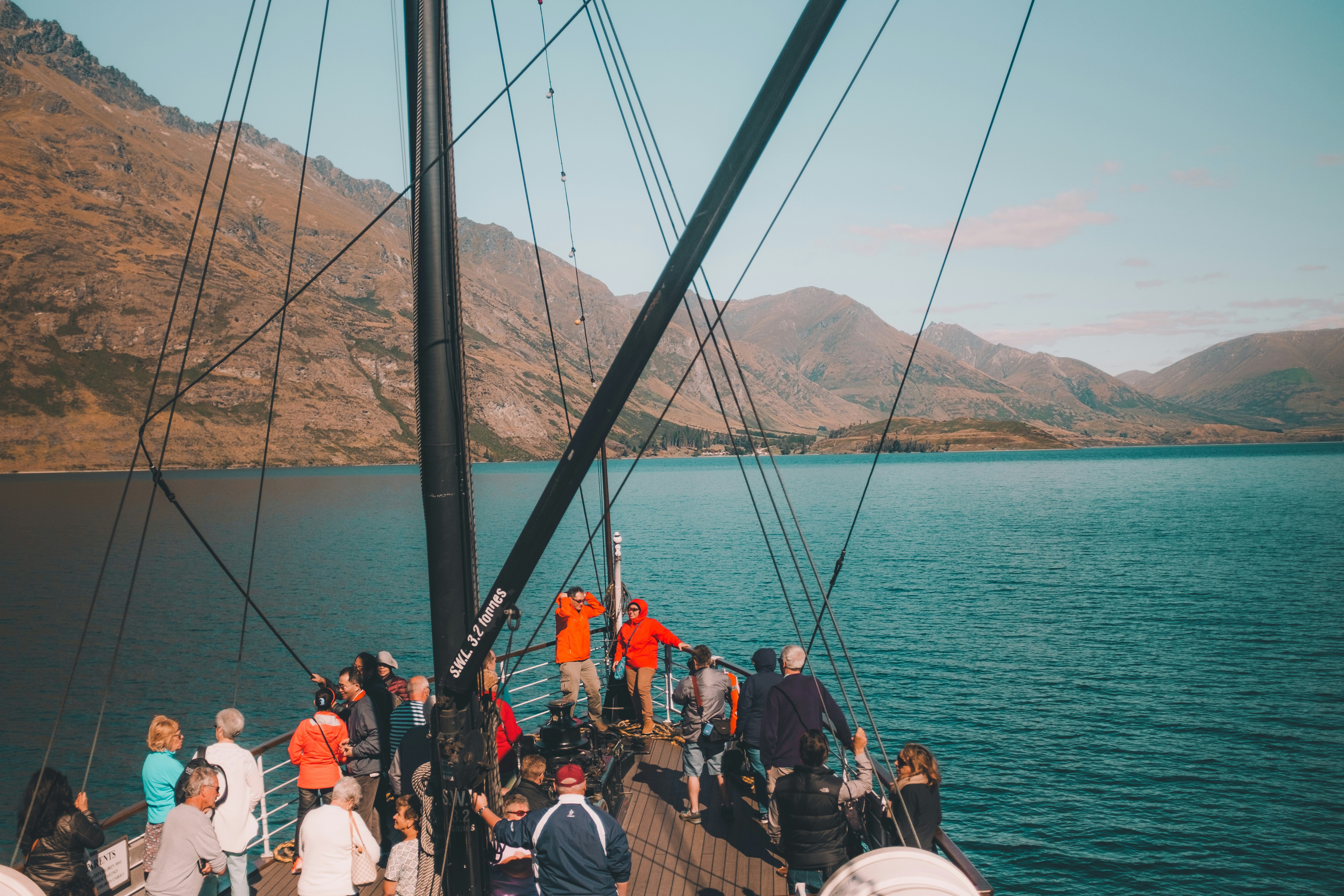 group of people on ship during daytime