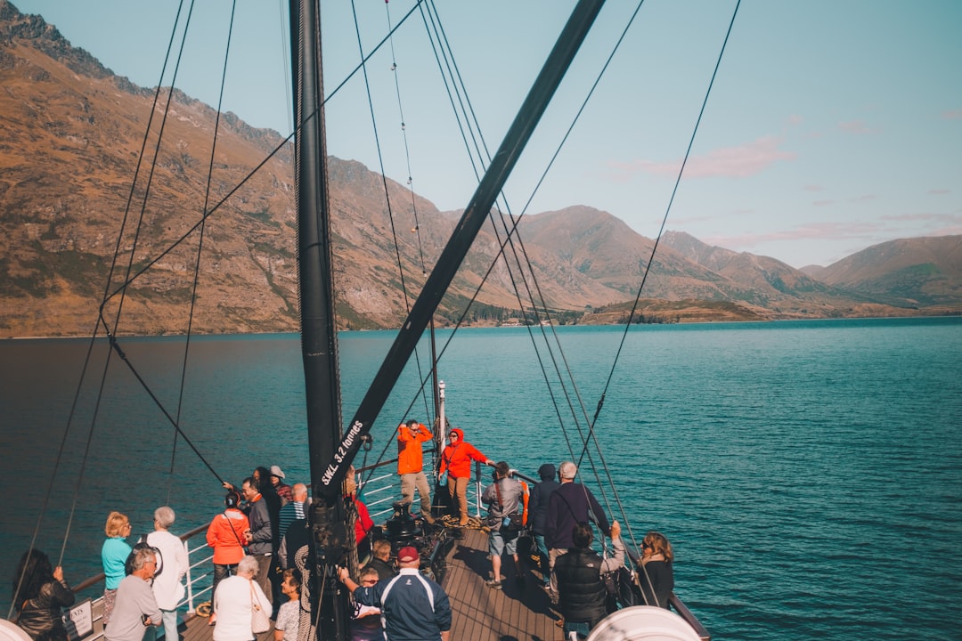 group of people on ship during daytime