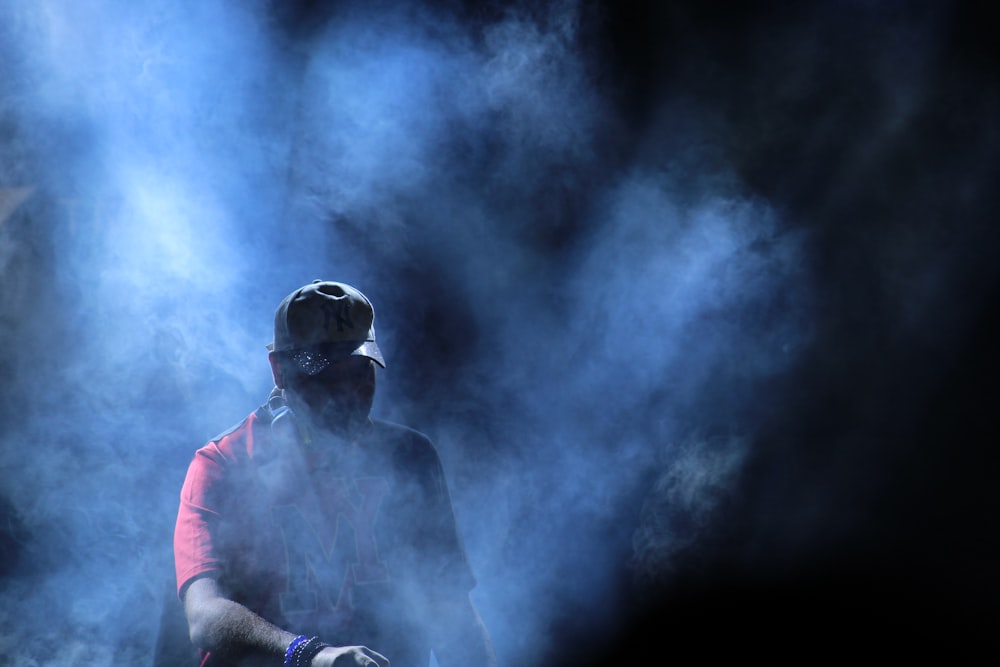man wearing gas mask with smoke
