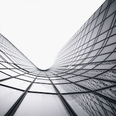 a black and white photo of a very tall building
