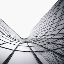 a black and white photo of a very tall building