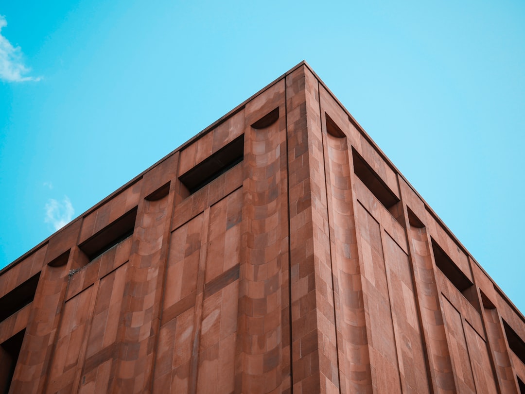 low angle photography of brown concrete wall